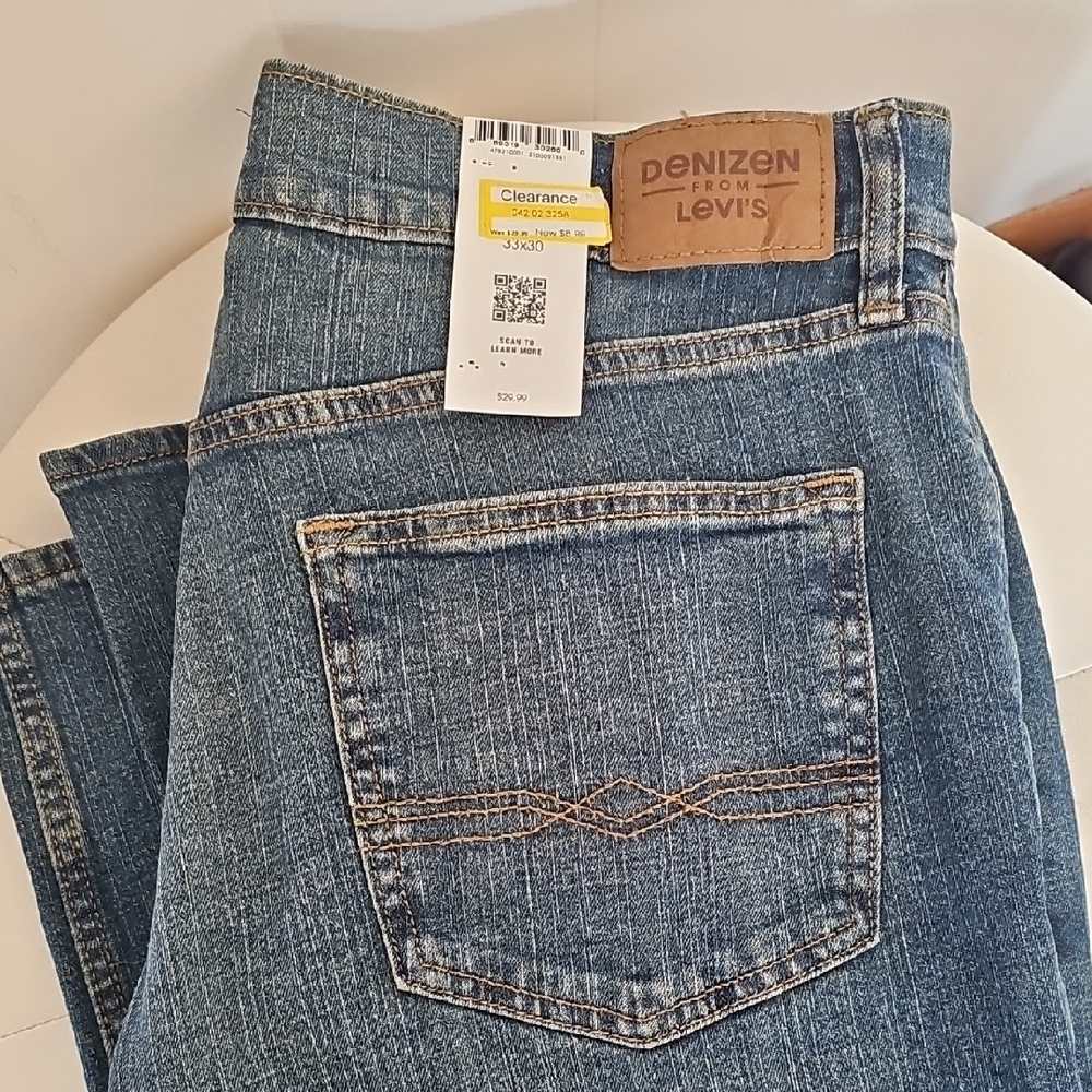 Denizen from Levi's blue denim straight jeans with tan leather patch